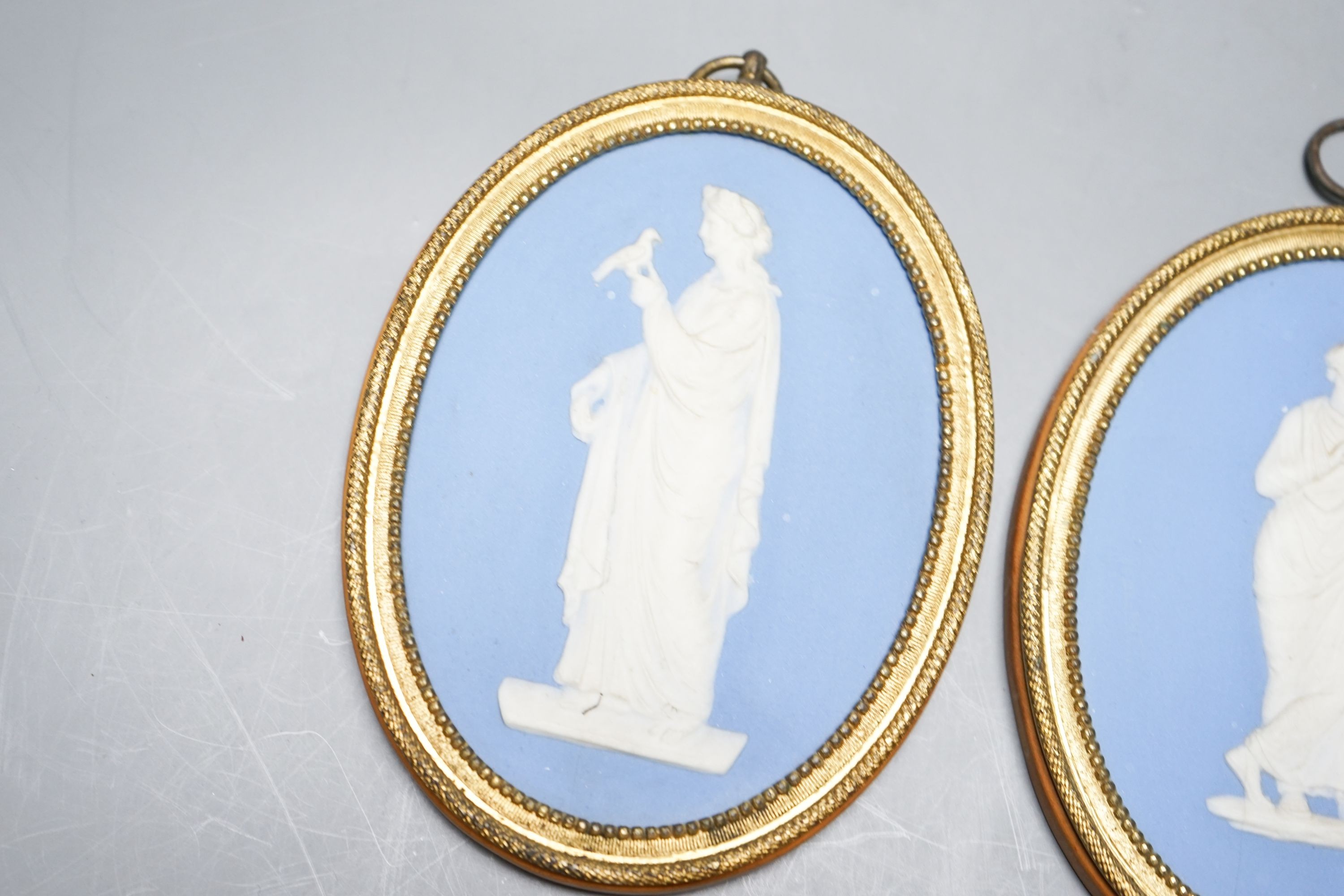 A pair of blue and white jasper oval miniature plaques, presumably Wedgwood, 16cm